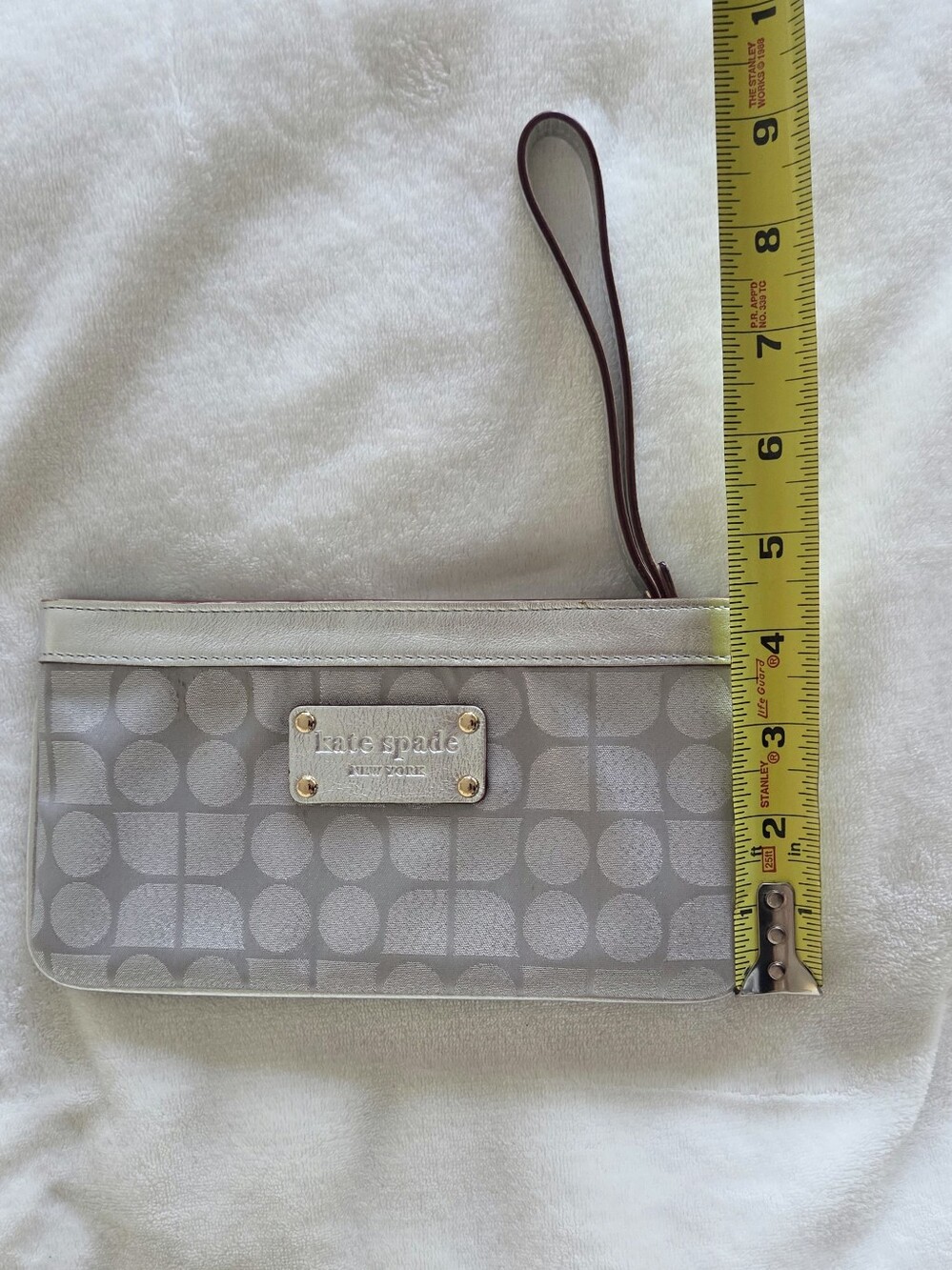 Metallic Silver Kate Spade Wristlet